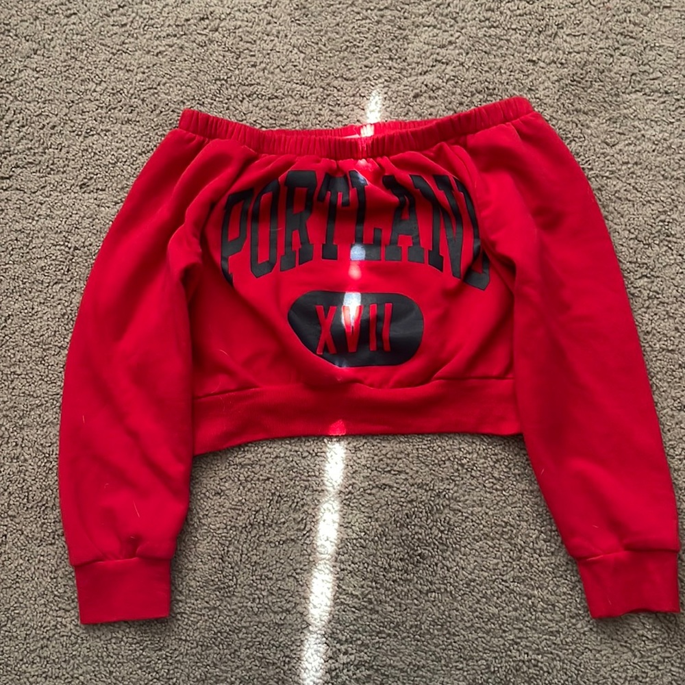 A red and blue sweatshirt material, crop top, off the shoulders. Size L